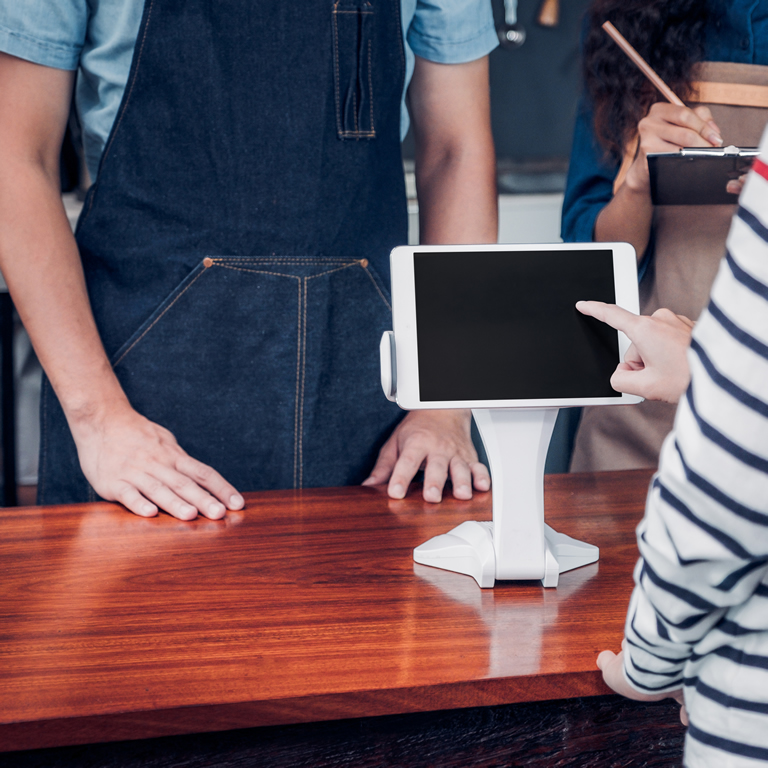 customer self service order drink menu with tablet screen at cafe counter bar,seller coffee shop accept payment by mobile.digital lifestyle concept.Blank space for display of design.clipping path 